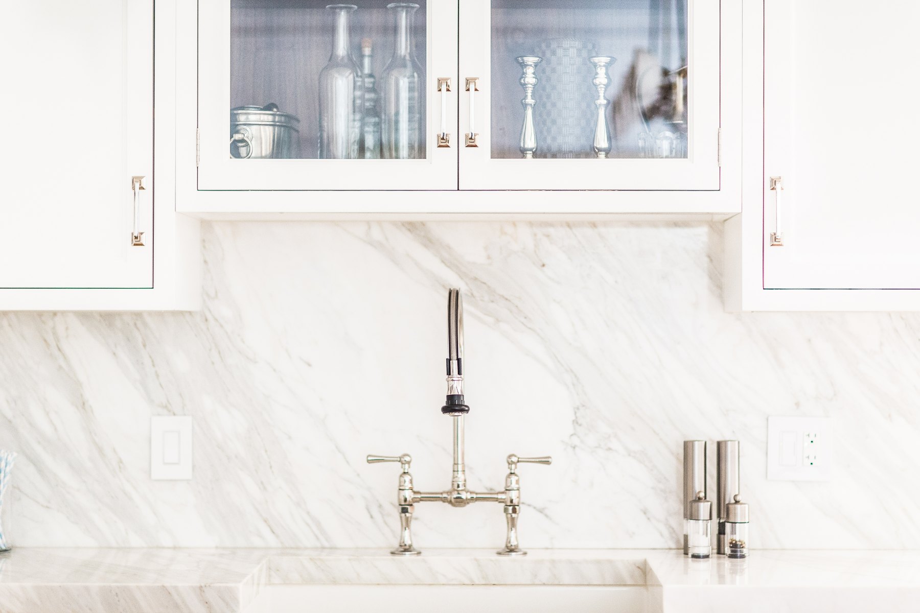 Sink and marble backsplash