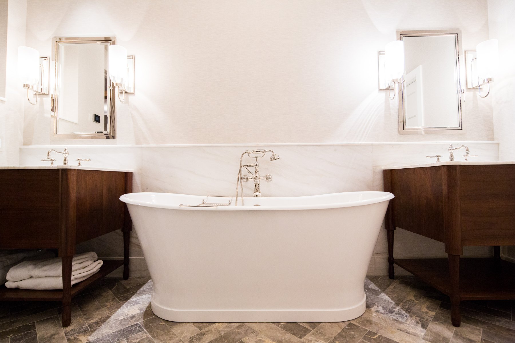 Bath with twin walnut vanities
