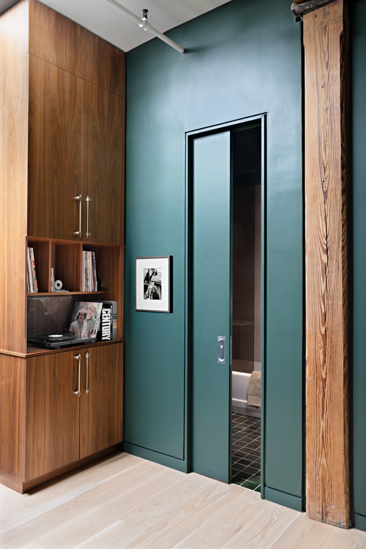 Pocket door and walnut millwork
