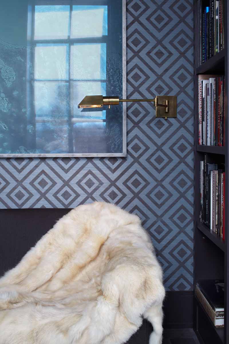 Den detail, brass sconce and grasscloth